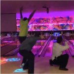 Three guys out bowling together