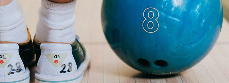 A pair of bowling shoes and bowling ball. A Great Summer Activity
